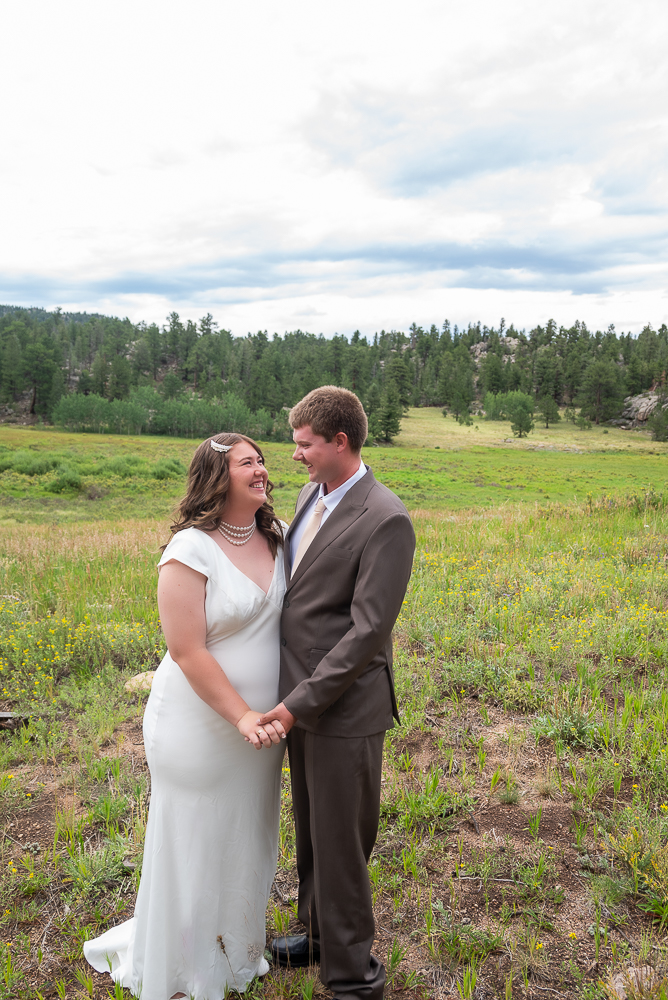 Last Minute Elopement in estes park, CO. Newlywed Couple stands in Moose Meadow in Hermit Park Open Space right before they got married.