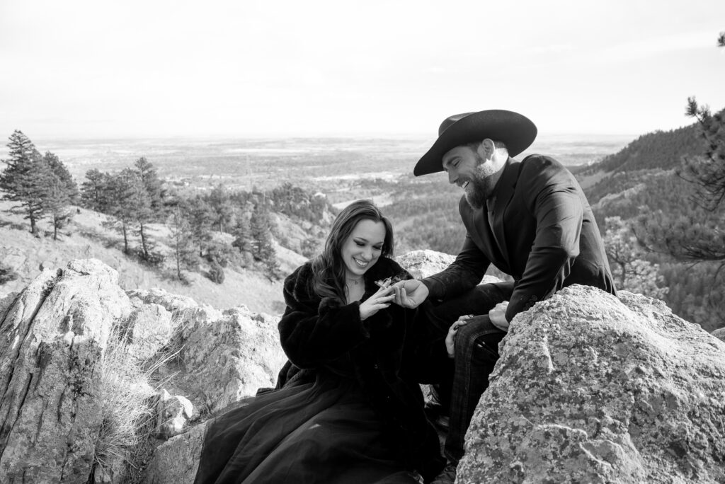 couple share a joint on flagstaff mountain in Boulder. 