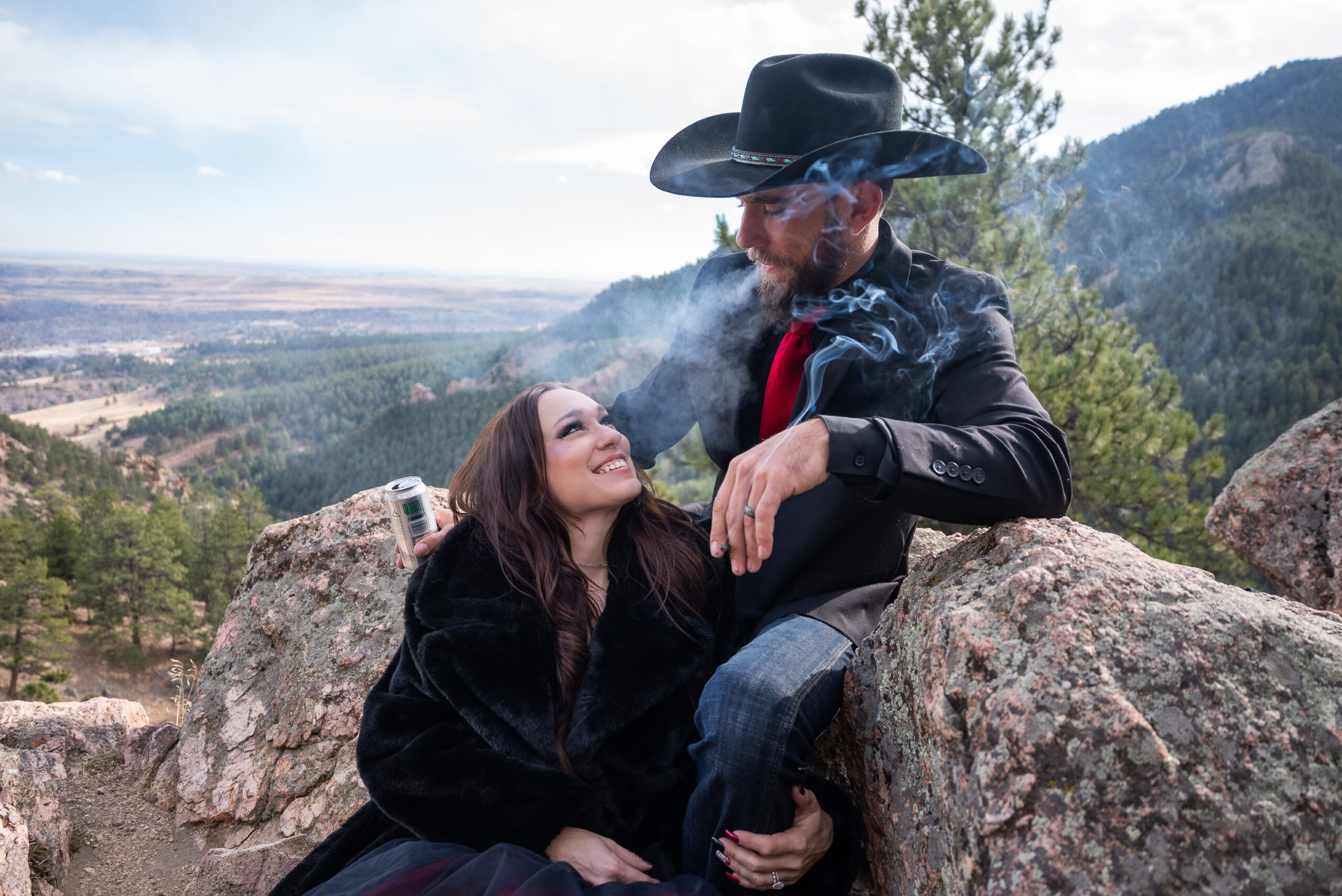 couple smokes a joint to celebrate their elopement.