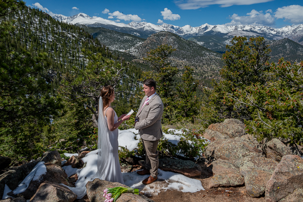 Couple stand on mountain peak and recites their vows. How to Plan an Epic Mountain Elopement Without Flaring Your Chronic Pain: The Ultimate "Spoonie" Guide